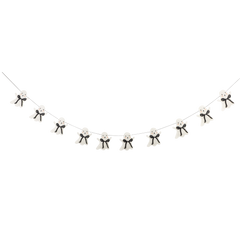 Decorative string with small black and white bear figures on a white background